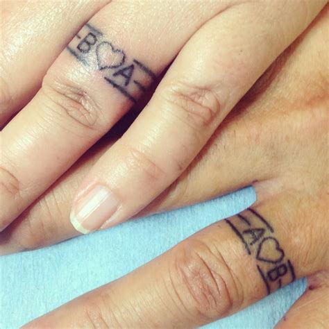 16 Wedding Ring Tattoos We Kind Of Love Ring Finger Tattoos Ring