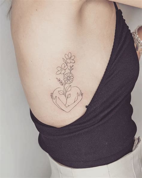 25 Attractive Rib Tattoo Designs