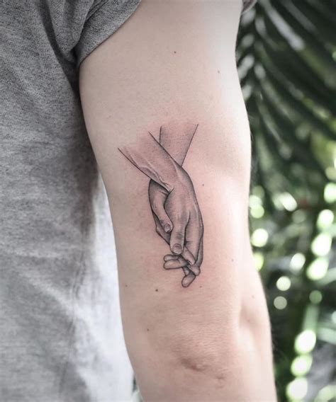 30 Great Holding Hands Tattoos You Will Love Hand Tattoos Tattoos 30 Great Holding Hands Tattoos You Will Love Hand Tattoos Tattoos