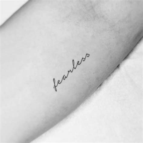 7 Fearless Tattoo Ideas Fearless Tattoo Wrist Tattoos Cursive Tattoos