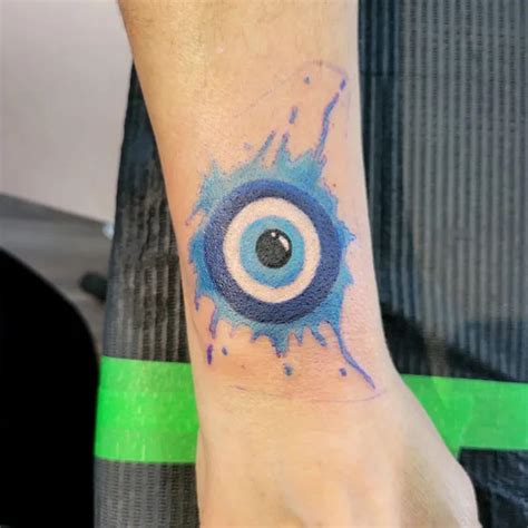 95 Protective And Meaningful Evil Eye Tattoos To Wear This Year