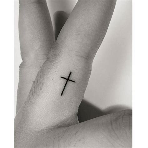 Cross Finger Tattoo