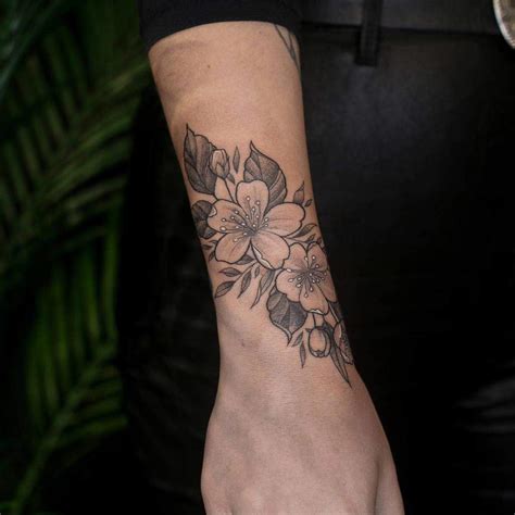 Elegant Flower Wrist Tattoo Ideas For A Delicate Look Wrap Around