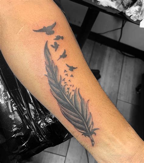 Feather Tattoo Design Feather Tattoo With Birds In 2025 Feather