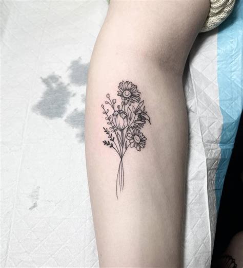 Fine Line Flower Bouquet Tattoo Located On The Forearm