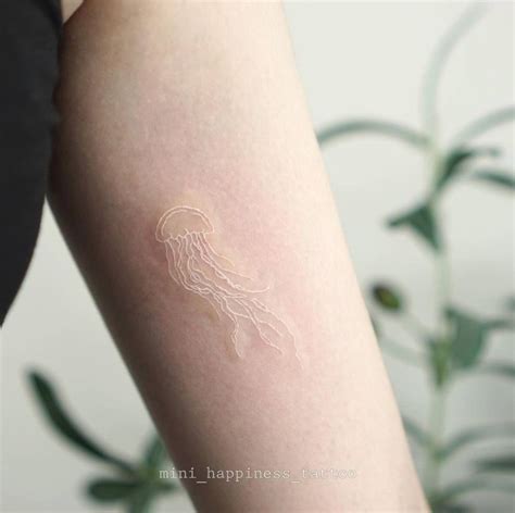 Fine Line Jellyfish Tattoo Done On The Inner Arm