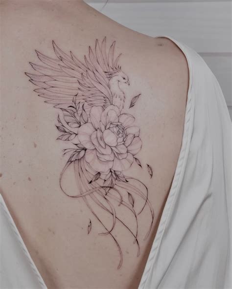 Phoenix And Lion Tattoo Design With Floral Details