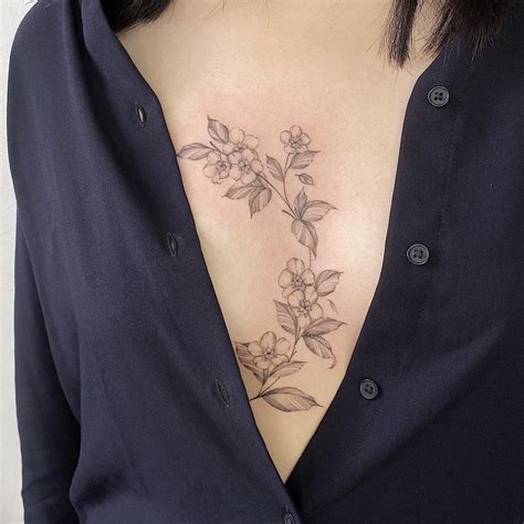 Simple Flower Sternum Tattoo At Nick Lopez Blog