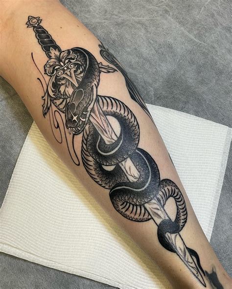 Sword And Snake Tattoos