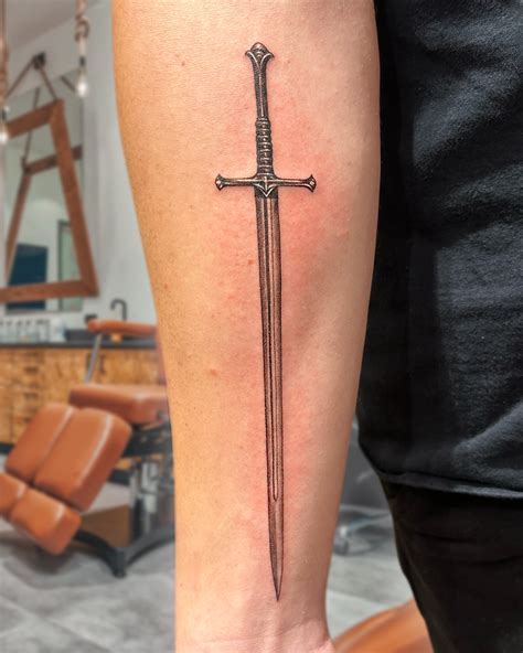 Sword Tattoo On The Left Forearm Sword Tattoo On The Left Forearm