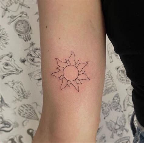 Tangled Sun Minimalist Tattoo