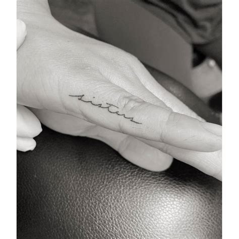 Tattoo Of The Word Amp Quot Sisters Amp Quot Handwritten On The Finger