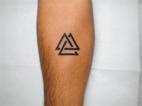 Three Triangle Tattoo Meaning Amp Symbolism Christianity Valknut Tattoo