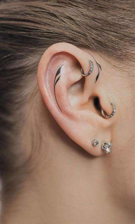 Whispered Ink 40 The Beauty Of Ear Tattoos Fine Line Leaf Ear Tattoo