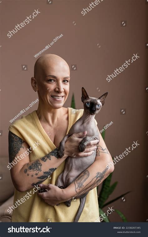 Woman Tattoos Bald Cat